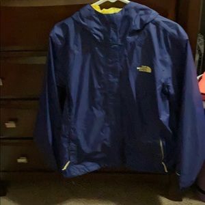 Blue and yellow north face jacket